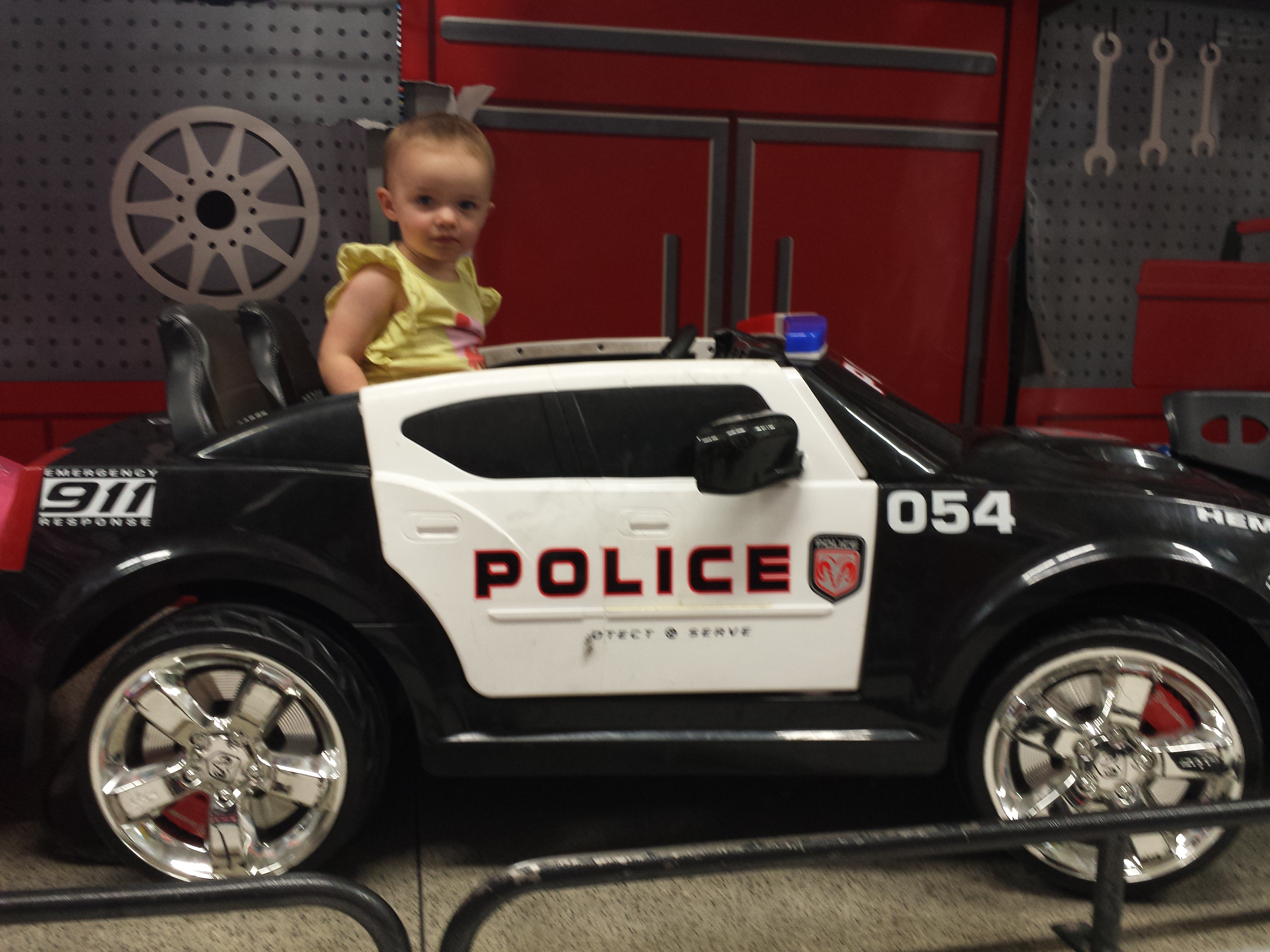 Arianna in police car