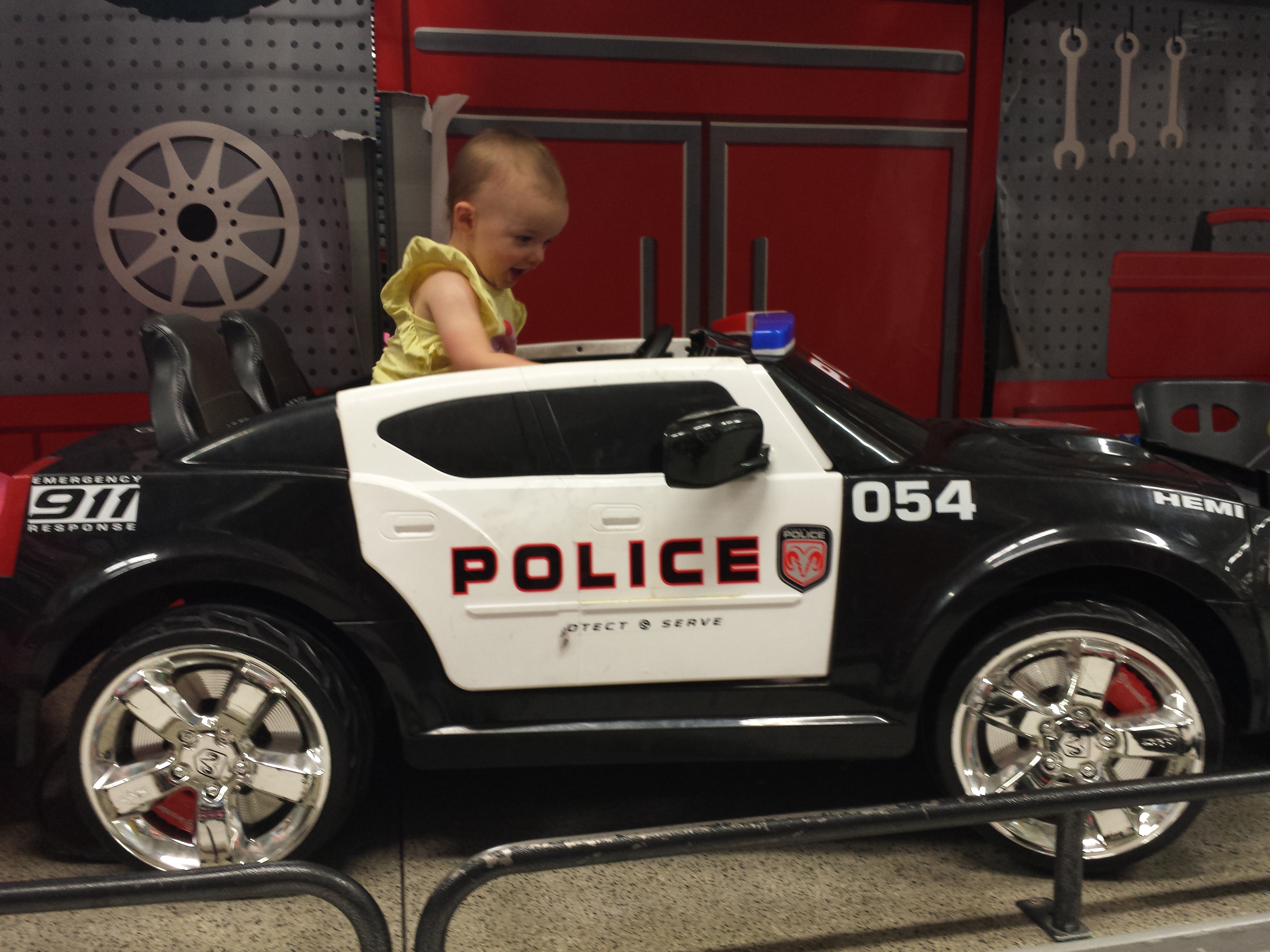 Arianna in police car