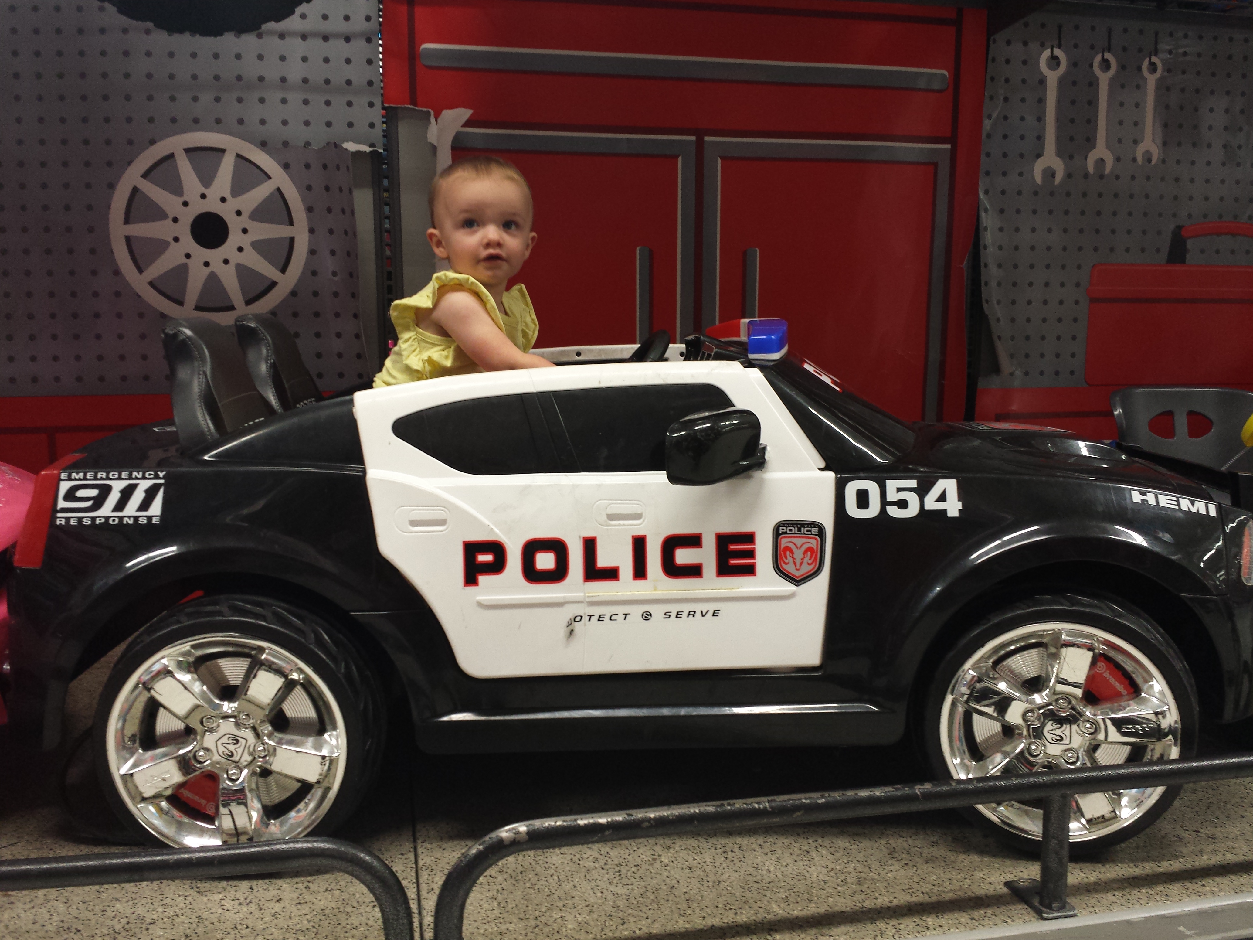 Arianna in police car